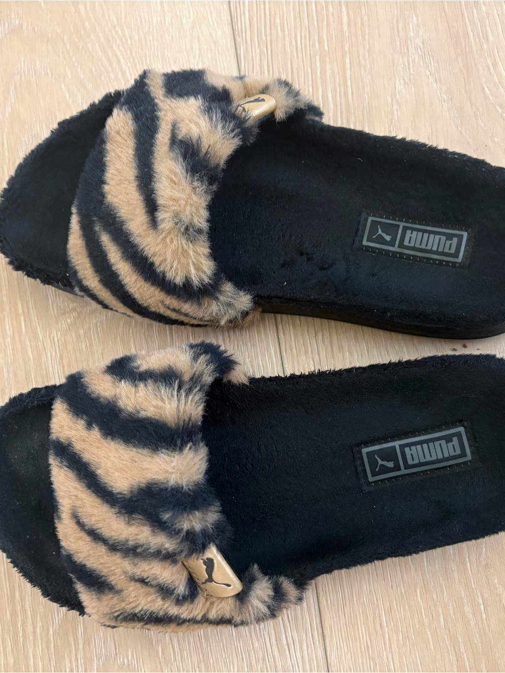 Puma Faux Fur Zebra-Print Slide Sandals in Black and Tan